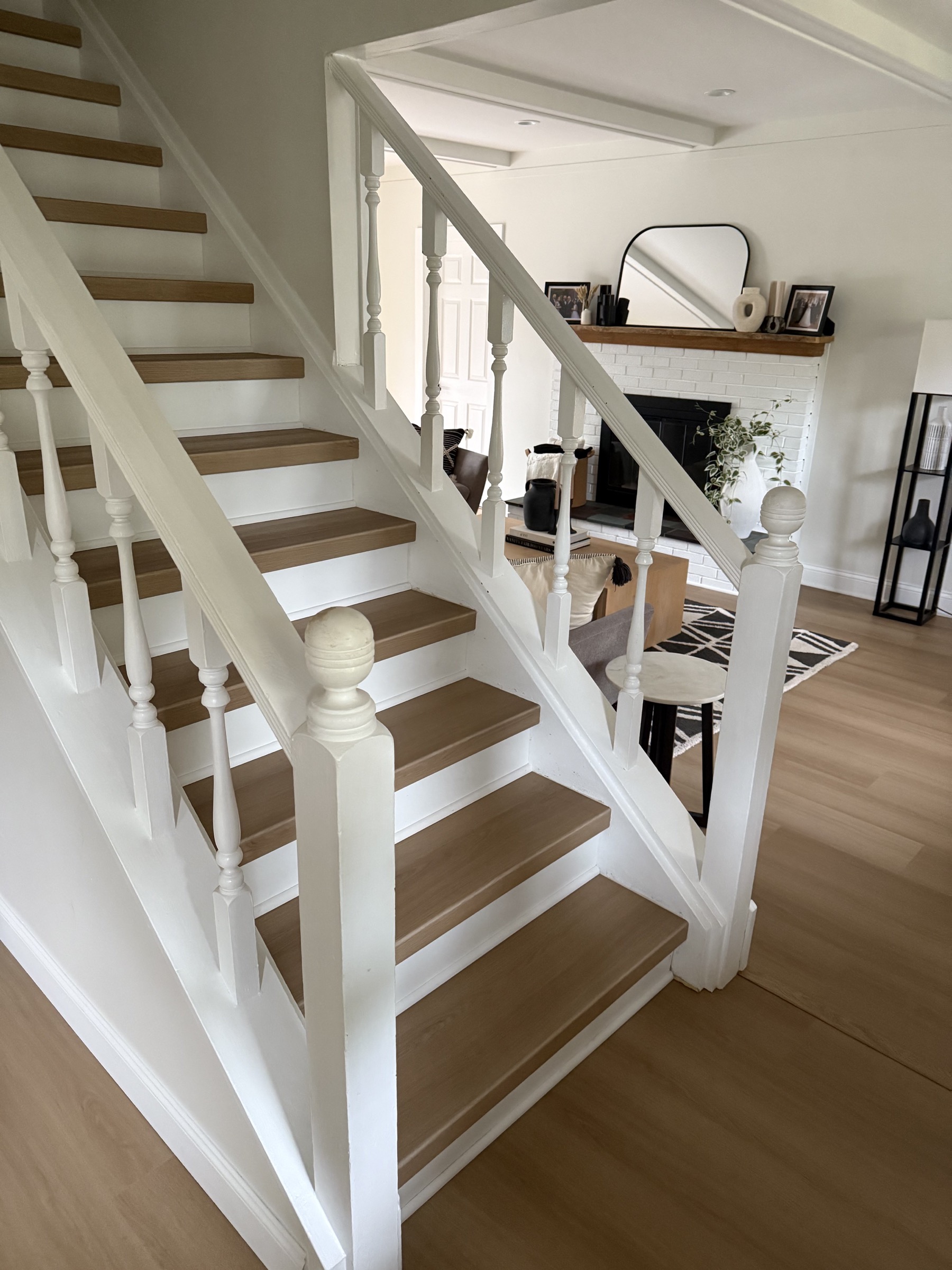 Matching vinyl flooring and folded vinyl stair treads in a finished Metro Detroit home